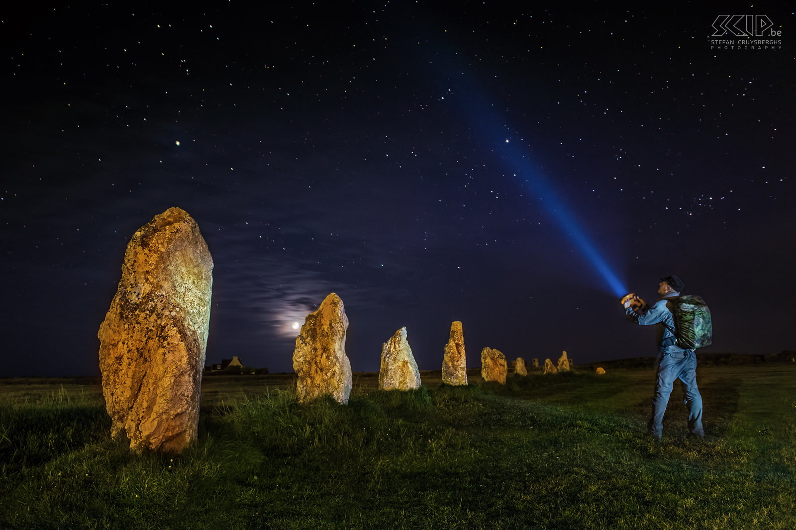 Crozon - Menhirs Lagatjar - Stefan The prehistoric menhirs from Lagatjar are an intriguing arrangement of hundreds of large prehistoric white quartz stones in an open field near the ocean. I used light painting techniques to create some night shots of the megaliths and at the end I was experimenting by adding myself with my torchlight towards the sky. When opening the RAW file at home I noticed that my camera had recorded so many colorful stars. Stefan Cruysberghs